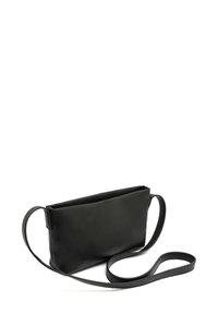 Black leather crossbody bag with a minimalist rectangular shape, smooth texture, and a long, flat strap extending from the sides.