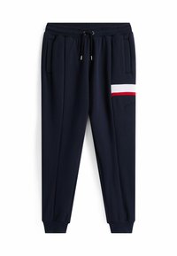 Navy Jogginghosen aus weichem Stoff, mit Seitentaschen, elastischem Bund mit Kordelzug und einem roten und weißen Streifen an der Seite.
