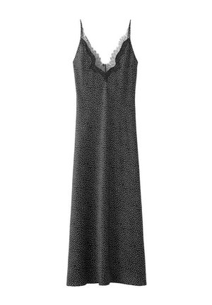 Black sleeveless slip dress with white polka dots and lace trim along the V-neckline and thin shoulder straps.