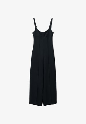 Combinaison noire avec des fines bretelles, design ajusté, décolleté droit et coupe évasée. Fabriquée en tissu lisse, avec des détails de couture à l'avant.