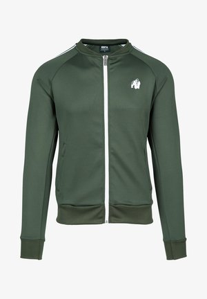 Zaļš jaku ar rāvējslēdzēju un raglāna piedurknēm, balti rāvējslēdzēji un gorillas logo uz krūškurvja. Tam ir sānu kabatas un ribota aproce. Gluda auduma faktūra.