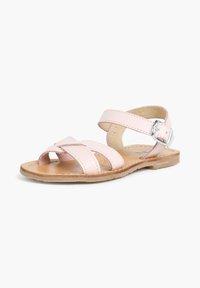 Roze leren sandalen met kruislings gespen en een gesp rond de enkel. Voorzien van een platte, natuurlijk gekleurde zool en een zachte binnenvoering.