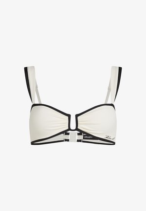 Top de bikini alb cu accente negre, având un design texturat, bretele late și un detaliu central decupat cu închidere cu clapă din plastic.