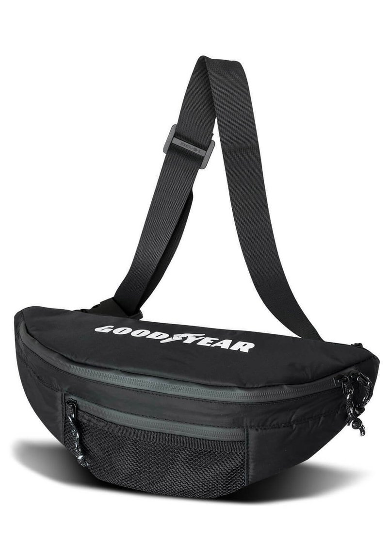 Black fabric sling bag with a curved shape, zippered compartments, mesh pocket, and adjustable strap; features a white "GOODYEAR" logo.
