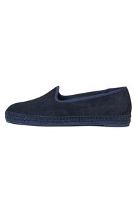 Navy suede slip-on shoe with a rubber sole, featuring a woven jute trim along the edge and a smooth, clean design.