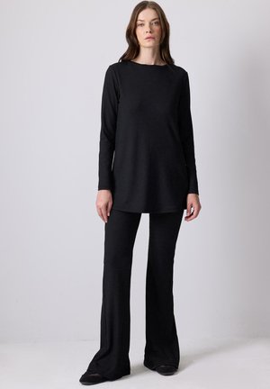 RIBBED - Hlače - siyah
