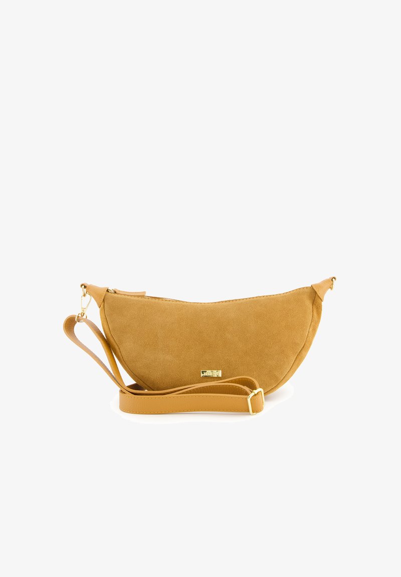 Suede crossbody bag in mustard yellow with a curved shape. Features a zip closure and a detachable strap with gold-tone hardware.