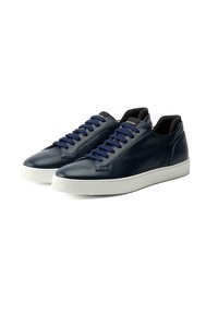 Navy leather sneakers with textured surface, white rubber sole, and blue laces. Design features a low-top silhouette and minimal branding.