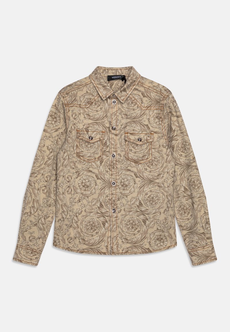 Camicia in denim beige con un dettagliato motivo floreale, due tasche frontali, cuciture a contrasto e un design di colletto classico.