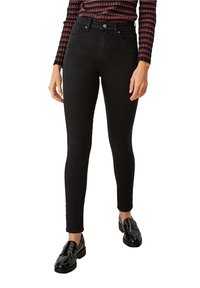 Černé skinny džíny vyrobené z elastického denimu, s klasickým pětikapsovým designem, hladkou texturou a středním pasem.