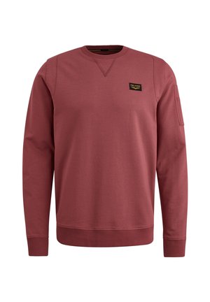 Mørkerød sweatshirt lavet af blødt stof. Har en rund halsudskæring, ribbede manchetter og et lille mærke på brystet. Enkel design.