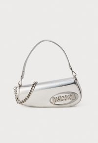 Silver metallic handbag with a rounded triangular shape, featuring a logo, chain strap, and smooth texture. Zipper closure on the side.