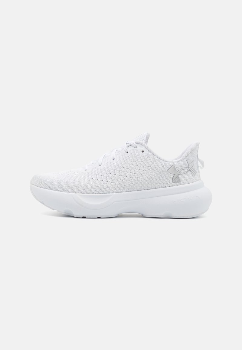 White athletic shoes with a textured mesh upper, lace-up design, padded collar, and a cushioned white sole. Features a subtle logo on the side.