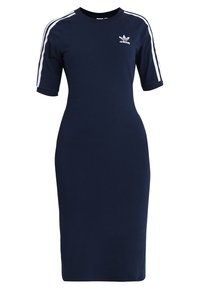 Navy blue cotton dress with short sleeves, featuring white side stripes and a small logo on the chest. Form-fitting, knee-length design.