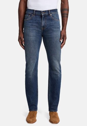 Dark blue denim jeans with a straight fit, featuring a classic five-pocket design, subtle distressing, and a zip fly with a button closure.