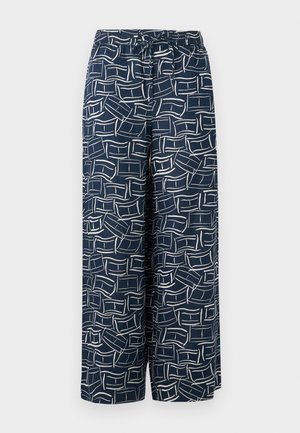 Granatowe spodnie o szerokich nogawkach z elastycznym pasem, zdobione abstrakcyjnym, białym wzorem prostokątnych linii.