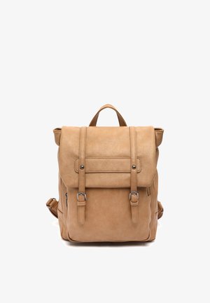 Tan leather backpack with front flap secured by two buckle straps and a top handle, photographed on white background.