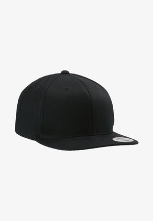 Black baseball cap with a flat brim, made of fabric. Six-panel design, embroidered eyelets for ventilation, and a stitched logo patch.