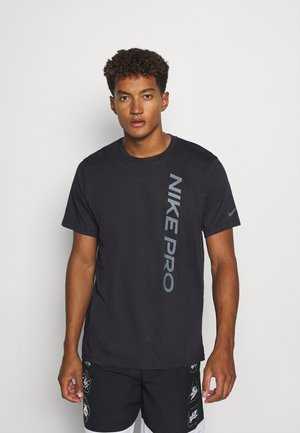 BURNOUT - T-shirt med print - black/smoke grey