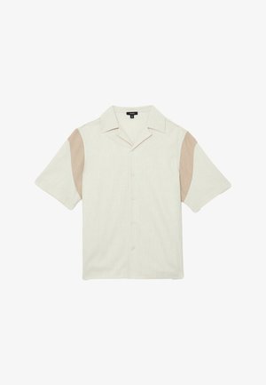 Rövid ujjú, bézs gombos ing tábori gallérral és világosbarna betétekkel a külső ujjrészen.