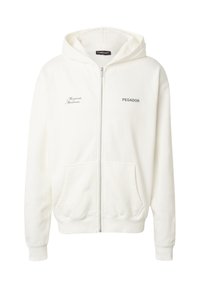 Sweat à capuche blanc avec fermeture éclair, poches avant, "PEGADOR" imprimé sur la poitrine droite et inscription "Moments Memories" sur la poitrine gauche.