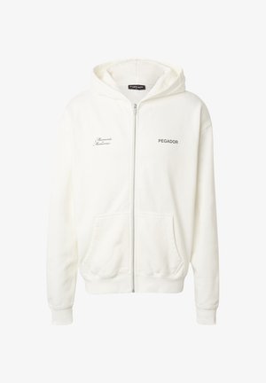 Biały rozpinany na zamek kaptur z kieszeniami z przodu, z nadrukiem "PEGADOR" na prawej piersi oraz napisem "Moments Memories" na lewej piersi.