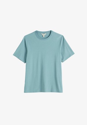 Svetlomodré krátke rukávy bavlnené tričko s okrúhlym výstrihom, rovný lem a viditeľná visačka vo vnútri goliera.