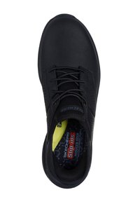 Sneaker in pelle nera con tomaia testurizzata, design con lacci, lati perforati e una soletta di colore brillante con il marchio "Skechers Slip-Ins".