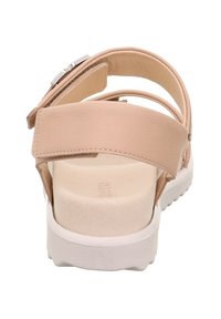 Hellrosa Sandalen mit verstellbaren Riemen, gepolstertem Fußbett und einer weißen Gummisohle. Das Design ist schlank und minimalistisch mit einer glatten Oberfläche.