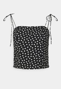 Camisola nera con piccoli motivi floreali bianchi, spalline regolabili a legatura e vestibilità rilassata. Realizzata in tessuto leggero.