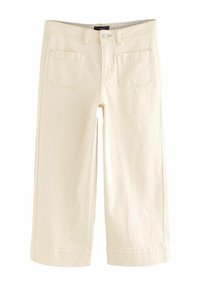 Crème kleurige cropped broek, gemaakt van denim, met twee achterzakken, gestikte naden en een omgeslagen zoom. Knoop- en ritsluiting.