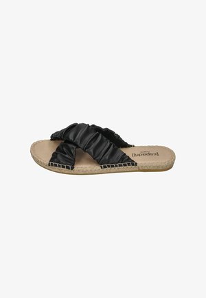 Black slide sandals with a textured, ruffled strap design, jute-like sole, and smooth inner footbed.