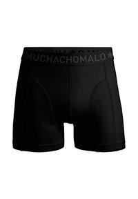 Fekete boxer alsónadrág puha rugalmas derékkal, amelyen a "MUCHACHOMALO" logó szerepel. Simaságot biztosító anyagból készült, testhez álló szabással és varrott részletekkel.