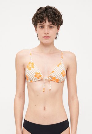 Triangle bikini top with orange floral pattern on a beige checkered background, adjustable ties, and thin straps. Black bikini bottom.