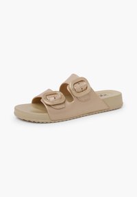 Beige slide sandal with two adjustable buckle straps, textured synthetic upper, and a lightweight, flexible rubber sole.