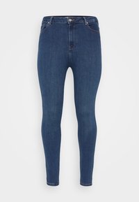 Schlankheitsjeans aus dunkelblauem Denim. Mit Reißverschluss vorne, Knopfverschluss und fünf Taschen. Glatte Textur mit minimalem Verblassen.