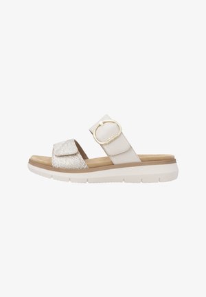 Women's beige slide sandal with two straps, one textured and one smooth with a gold ring buckle, and a white cushioned sole.