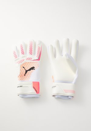 Guanti da portiere bianchi con accenti rosa, motivo di presa testurizzato e logo nero. Presentano un polsino aderente per una vestibilità sicura.