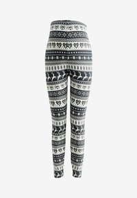 Sort-hvide leggings med mønster af rensdyr, hjerter og snefnug, udstyret med høj talje og en tætsiddende pasform.