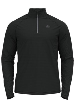 Haut de sport noir à manches longues avec col zippé au quart et logo discret sur la poitrine gauche, conçu pour la performance et la superposition.