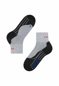 Ett par grå och svarta ankelsockor med röd och blå text, inklusive "R" för höger fot och storleksinformation på sulan.