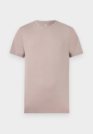 Tricou bej deschis cu mâneci scurte și guler rotund, cu textură moale și cusături vizibile pe mâneci și la tiv.