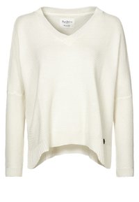 Kremowy sweter z dzianiny z dekoltem w serek, luźnym fasonem, opadającymi ramionami i ściągaczem u dołu. Posiada małą metkę marki po bokach.