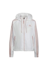 Veste coupe-vent blanche Adidas avec des rayures rose clair sur les manches, fermeture éclair sur le devant, capuche avec cordons de serrage et poches latérales zippées.