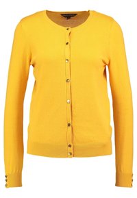 Gul stickad kofta med rund hals, knäppning fram med metallknappar och ribbade muddar med knappdetaljer.