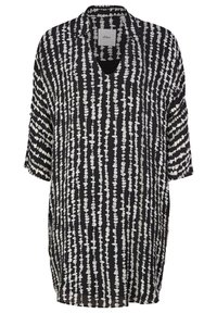 Svart och vit mönstrad kortärmad skjorta med V-ringning, som har en luftig och avslappnad passform samt ett upprepande prick- och linjemönster.