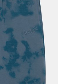 Levi's® TIE DYE RELAXED CORE - Teplákové kalhoty - aegean blue