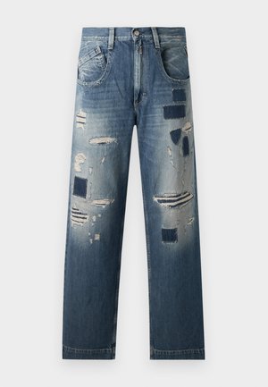 Denim jeans with distressed patches and varying shades of blue, featuring a straight-leg cut and traditional five-pocket design.