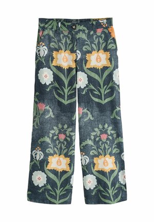 Dunkelblaue Hosen mit weitem Bein und großem Blumenmuster in Gelb, Weiß, Pink und Grün.