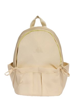 Beige-reppu, jossa on etutasku vetoketjulla, sivusoljet, kaksinkertaiset olkahihnat ja yläkuljetuskahva.